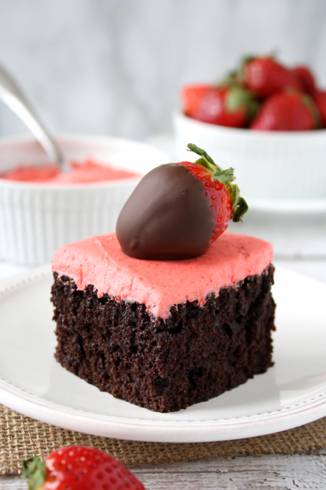 chocolate snack cake with strawberry frosting